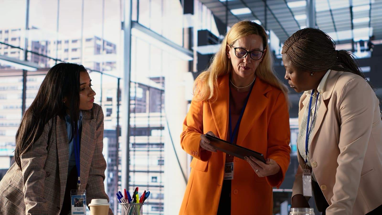 Business team reviewing data together on a tablet