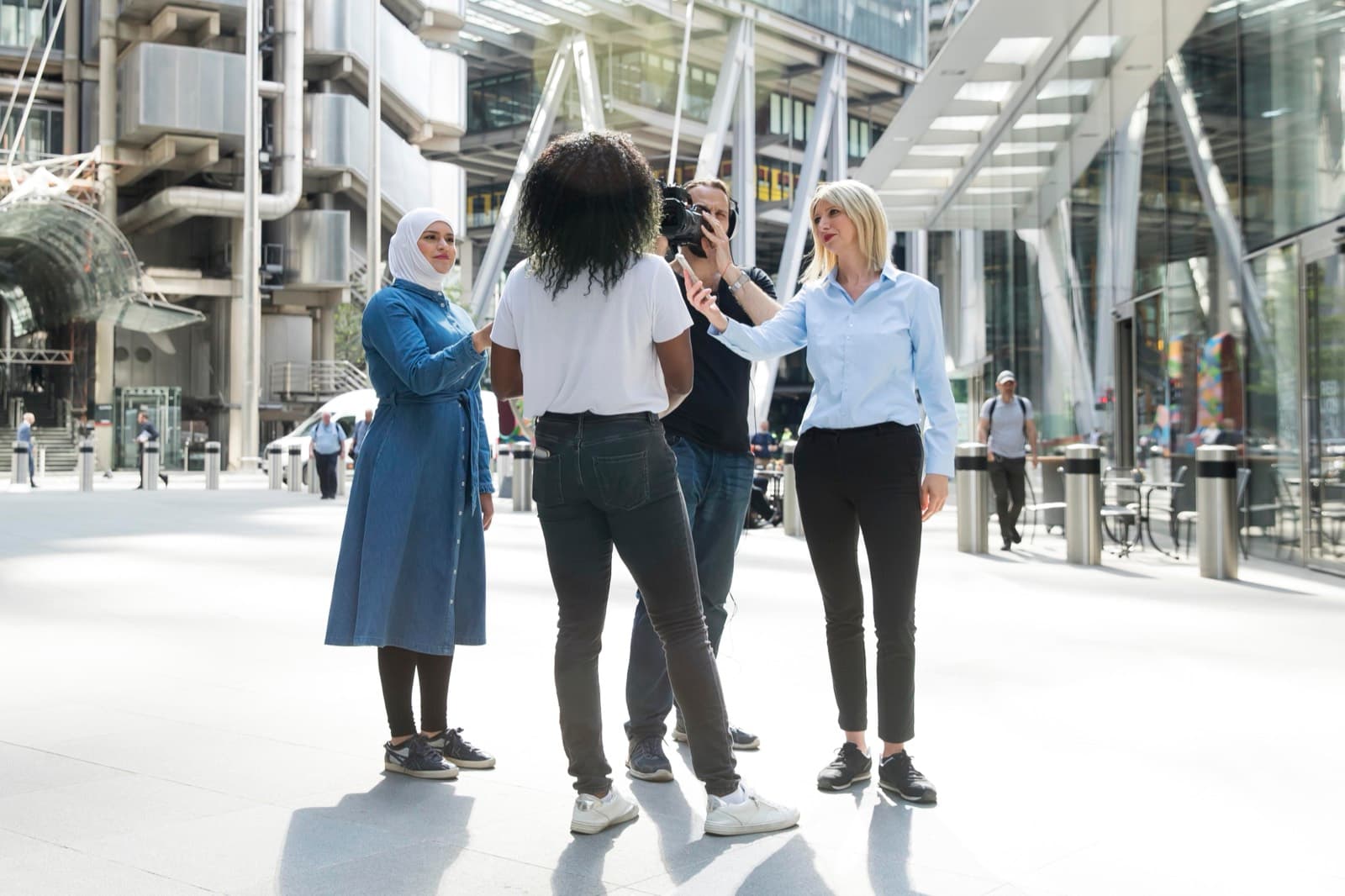 Professionals in discussion in a modern business district